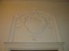 Stucreli�f met cartouche boven de deur. (&copy; Walther Schoonenberg)