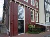 Driehoekig erfje met pothuis als restant van oude rooilijn (&copy; Walther Schoonenberg)