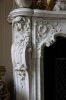 Detail van de witmarmeren schouw Detail van de witmarmeren schouw (© Walther Schoonenberg)