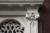 Detail van de deuromlijsting Detail van de deuromlijsting (© Walther Schoonenberg)