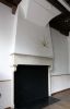 Gereconstrueerde schouw in de doelenzaal met een gemetseld gewelf voor de schouw daarboven Gereconstrueerde schouw in de doelenzaal met een gemetseld gewelf voor de schouw daarboven (© Walther Schoonenberg)