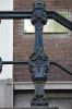 Stoepbaluster in rococo-stijl (van elders) (&copy; Walther Schoonenberg)