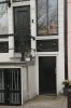 Ingang naar gang naar inpandige huizen Ingang naar gang naar inpandige huizen (© Walther Schoonenberg)