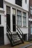Houten onderpui met frontale houten trap (&copy; Walther Schoonenberg)