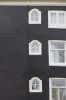Drie traplichten in de zijgevel (Tweede Leliedwarsstraat 2) (© Walther Schoonenberg)