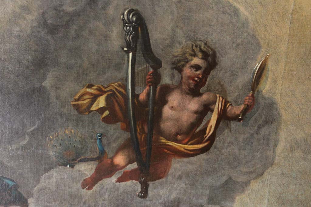 De putto met harp, spiegel en achter zich een pauw staat voor het element Lucht.  (&copy; Walther Schoonenberg)